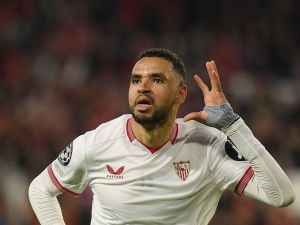 Sevilla's Moroccan forward #15 Youssef En-Nesyri celebrates scoring the second goal during the UEFA Champions League first round group B football match between Sevilla FC and PSV Eindhoven at the Ramon Sanchez Pizjuan stadium in Seville on November 29, 2023. (Photo by JORGE GUERRERO / AFP)