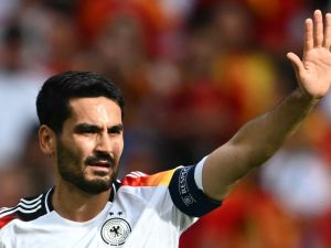 Germany's midfielder #21 Ilkay Gundogan gestures during the UEFA Euro 2024 quarter-final football match between Spain and Germany at the Stuttgart Arena in Stuttgart on July 5, 2024. (Photo by Fabrice COFFRINI / AFP)