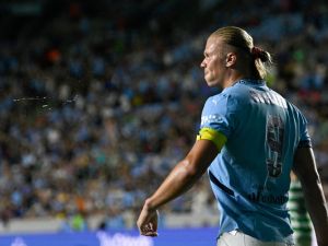 Manchester City's Norwegian striker #09 Erling Haaland celebrates scoring his team's third goal during the 2024 FC Series pre-season friendly football match between Manchester City and Celtic at the Kenan Memorial Stadium in Chapel Hill, North Carolina, July 23, 2024. (Photo by Peter Zay / AFP)