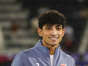 Iraq's forward #07 Ali Jasim poses with the AFC Qatar 2024 Asian Cup top goal scorer trophy after the U23 AFC Qatar 2024 Asian Cup final match between Japan and Uzbekistan at Jassim Bin Hamad Stadium in Doha on May 3, 2024. (Photo by KARIM JAAFAR / AFP)