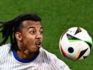 France's defender #05 Jules Kounde looks at the ball during the UEFA Euro 2024 Group D football match between the Netherlands and France at the Leipzig Stadium in Leipzig on June 21, 2024. (Photo by GABRIEL BOUYS / AFP)