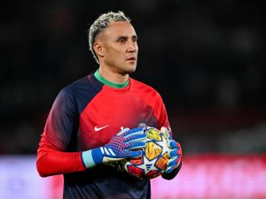 Paris Saint-Germain's Costa Rican Goalkeeper #01 Keylor Navas holds the ball as he warms up ahead of the UEFA Champions League round of 16 first leg football match between Paris Saint-Germain (PSG) and Real Sociedad at the Parc des Princes Stadium in Paris, on February 14, 2024. (Photo by MIGUEL MEDINA / AFP)