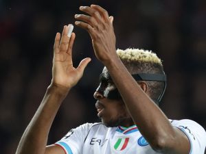 Napoli's Nigerian forward #09 Victor Osimhen claps during the UEFA Champions League last 16 second leg football match between FC Barcelona and SSC Napoli at the Estadi Olimpic Lluis Companys in Barcelona on March 12, 2024. (Photo by LLUIS GENE / AFP)