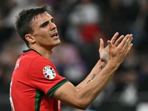 Portugal's midfielder #06 Joao Palhinha reacts to a missed chance during the UEFA Euro 2024 round of 16 football match between Portugal and Slovenia at the Frankfurt Arena in Frankfurt am Main on July 1, 2024. (Photo by JAVIER SORIANO / AFP)