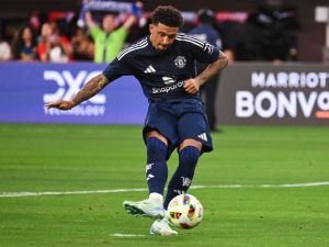 Manchester United's forward #25 Jadon Sancho scores a penalty kick during the pre-season club friendly football match between Manchester United FC and Arsenal FC at SoFi Stadium in Inglewood, California on July 27, 2024. (Photo by Patrick T. Fallon / AFP)