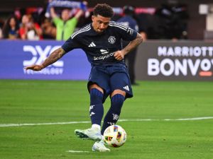 Manchester United's forward #25 Jadon Sancho scores a penalty kick during the pre-season club friendly football match between Manchester United FC and Arsenal FC at SoFi Stadium in Inglewood, California on July 27, 2024. (Photo by Patrick T. Fallon / AFP)
