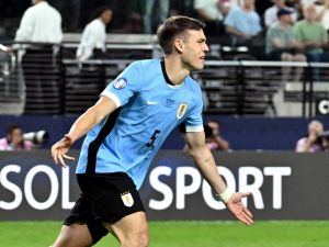 Uruguay's midfielder #05 Manuel Ugarte celebrates after scoring in a penalty shoot-out to win the Conmebol 2024 Copa America tournament quarter-final football match between Uruguay and Brazil at Allegiant Stadium in Las Vegas, Nevada on July 6, 2024. (Photo by Robyn Beck / AFP)