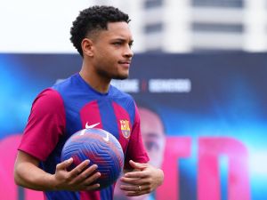 Brazilian forward Vitor Roque holds a ball during his official presentation as new player of FC Barcelona at the Joan Gamper training ground in Sant Joan Despi, near Barcelona, on January 5, 2024. (Photo by Pau BARRENA / AFP)