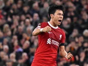 Liverpool's Japanese midfielder #03 Wataru Endo celebrates scoring the team's second goal during the UEFA Europa League group E football match between Liverpool and Toulouse at Anfield in Liverpool, north west England on October 26, 2023. (Photo by Oli SCARFF / AFP)