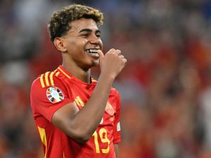 Spain's forward #19 Lamine Yamal celebrates at the end of the UEFA Euro 2024 semi-final football match between Spain and France at the Munich Football Arena in Munich on July 9, 2024. (Photo by MIGUEL MEDINA / AFP)