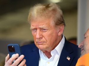 Donald Trump holding phone 