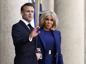 France's President Emmanuel Macron (L) and France's first lady Brigitte Macron. (Photo by Sameer Al-Doumy / AFP) Brigitte Macron