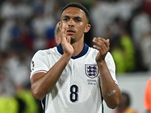 England's defender #08 Trent Alexander-Arnold applauds fans on the pitch after the UEFA Euro 2024 Group C football match between England and Slovenia at the Cologne Stadium in Cologne on June 25, 2024. (Photo by JAVIER SORIANO / AFP)
