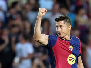 Barcelona's Polish forward #09 Robert Lewandowski celebrates scoring his team's second goal during the Spanish league football match between FC Barcelona and Athletic Club Bilbao at the Estadi Olimpic Lluis Companys in Barcelona on August 24, 2024. (Photo by LLUIS GENE / AFP)