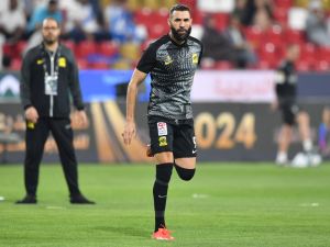 Ittihad's French forward #09 Karim Benzema warms up ahead of the Saudi Super Cup final football match between Al-Ittihad and Al-Hilal at the Mohammed bin Zayed Stadium in Abu Dhabi on April 11, 2024. (Photo by Ryan LIM / AFP)