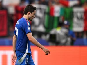 Italy's forward #14 Federico Chiesa reacts at the end of the UEFA Euro 2024 round of 16 football match between Switzerland and Italy at the Olympiastadion Berlin in Berlin on June 29, 2024. (Photo by Kirill KUDRYAVTSEV / AFP)