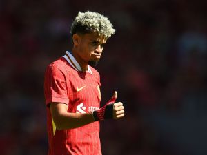 Liverpool's Colombian midfielder #07 Luis Diaz reacts during the pre-season friendly football match between Liverpool and Sevilla at Anfield stadium in Liverpool, northwest England on August 11, 2024. (Photo by Peter POWELL / AFP)