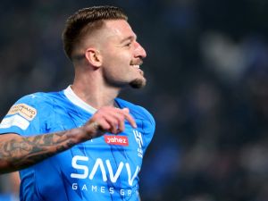 Hilal's Serbian midfielder #22 Sergej Milinkovic-Savic celebrates his goal during the Riyadh Season Cup final match between Al-Nassr and Al-Hilal at the Kingdom Arena in Riyadh, on February 8, 2024. (Photo by Fayez Nureldine / AFP)