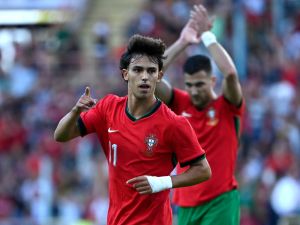 Portugal's forward #11 Joao Felix celebrates scoring a goal during the International friendly match between Portugal and Ireland at the Municipal Stadium in Aveiro, on June 11, 2024, ahead of the UEFA Euro 2024 football tournament in Germany. (Photo by MIGUEL RIOPA / AFP)