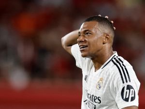 Real Madrid's French forward #09 Kylian Mbappe reacts during the Spanish league football match between RCD Mallorca and Real Madrid CF at the Mallorca Son Moix stadium in Palma de Mallorca on August 18, 2024. (Photo by OSCAR DEL POZO / AFP)