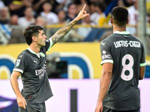 AC Milan's American forward #11 Christian Pulisic celebrates after scoring his team's first goal during the Italian Serie A football match between Parma Calcio 1913 and AC Milan at Ennio-Tardini Stadium in Parma, on August 24, 2024. (Photo by Piero CRUCIATTI / AFP)