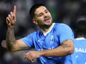 Hilal's Serbian forward #09 Aleksandar Mitrovic celebrates after scoring his team's third goal during the AFC Champions League football match between Saudi Arabia's Al-Hilal SFC and Iran’s Sepahan FC at the Kingdom Arena Stadium in Riyadh on February 22, 2024. (Photo by Fayez NURELDINE / AFP)