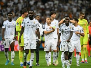 Real Madrid's players react after the UEFA Super Cup football match between Real Madrid and Atalanta BC in Warsaw, on August 14, 2024. (Photo by Sergei GAPON / AFP)