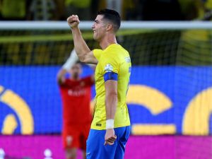 Nassr's Portuguese forward #07 Cristiano Ronaldo celebrates after scoring during the Saudi Pro League football match between Al-Ittihad and Al-Nassr at the King Saud University Stadium in Riyadh on May 27, 2024. (Photo by Fayez NURELDINE / AFP)