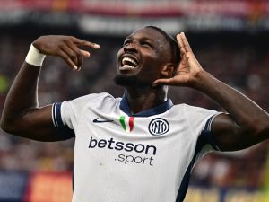 Inter Milan’s French forward #09 Marcus Thuram celebrates scoring his team's second goal during the Italian Serie A football match between Genoa and Inter Milan at the Luigi Ferraris Stadium in Genoa, on August 17, 2024. (Photo by MARCO BERTORELLO / AFP)