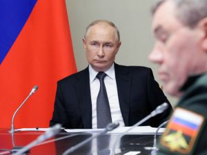 In this pool photograph distributed by Russian state owned agency Sputnik, Russia's President Vladimir Putin (L) chairs a meeting regarding the situation in the Kursk region, in his residence in Novo-Ogaryovo outside Moscow, on August 12, 2024. Photo by Gavriil GRIGOROV / POOL / AFP)