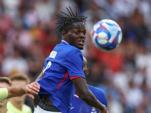 Castello Lukeba fights for the ball in the men's gold medal final football match between France and Spain during the Paris 2024 Olympic Games at the Parc des Princes in Paris on August 9, 2024. (Photo by Franck FIFE / AFP)