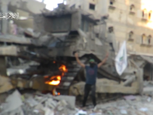 Video: Hamas fighter raises flag on Israeli tank then burns it