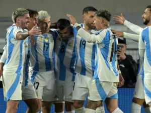 Argentina's midfielder Paulo Dybala (2nd L) celebrates with teammates after scoring during the 2026 FIFA World Cup South American qualifiers football match between Argentina and Chile at the Mas Monumental stadium in Buenos Aires on September 5, 2024. (Photo by JUAN MABROMATA / AFP)