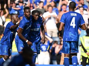 Chelsea's French midfielder #16 Lesley Ugochukwu celebrates after scoring the equalising goal during the pre-season friendly football match between Chelsea and Inter Milan at the Stamford Bridge stadium in London on August 11, 2024. (Photo by JUSTIN TALLIS / AFP)