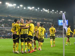 Dortmund´s players celebrate after winning the UEFA Champions League's 1st round day 1 football match between Club Brugge KV and Borussia Dortmund at the Jan Breydel Stadium in Bruges on September 18, 2024. (Photo by NICOLAS TUCAT / AFP)