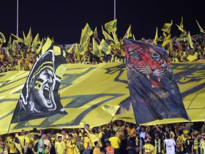 Ittihad fans cheer ahead of the Saudi Pro League football match between Al-Hilal and Al-Ittihad at the Prince Faisal bin Fahd Stadium in Riyadh on September 21, 2024. (Photo by Fayez NURELDINE / AFP)
