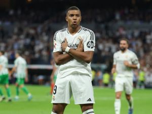 Real Madrid's French forward #09 Kylian Mbappe celebrates scoring his team's second goal from the penalty spot during the Spanish league football match between Real Real Madrid CF and Real Betis at the Santiago Bernabeu stadium in Madrid on September 1, 2024. (Photo by Thomas COEX / AFP)