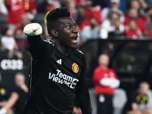 Manchester United's goalkeeper Andre Onana yells at teammates after saving the ball during a pre-season friendly football match between Manchester United FC and Borussia Dortmund at the Allegiant Stadium in Las Vegas, Nevada, on July 30, 2023. (Photo by Patrick T. Fallon / AFP)
