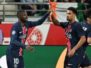 Paris Saint-Germain's French forward #10 Ousmane Dembele (L) celebrates scoring his team's first goal during the French L1 football match between Stade de Reims and Paris Saint-Germain (PSG) at Stade Auguste-Delaune in Reims, northern France on September 21, 2024. (Photo by FRANCOIS NASCIMBENI / AFP)