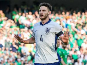 England's midfielder #04 Declan Rice reacts after scoring the team's first goal during the UEFA Nations League, League B, group 2, football match between Ireland and England at the Aviva Stadium, in Dublin, on September 7, 2024. (Photo by PAUL FAITH / AFP)