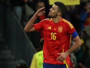 Spain's midfielder #16 Rodri celebrates scoring his team's third goal during the international friendly football match between Spain and Brazil at the Santiago Bernabeu stadium in Madrid on March 26, 2024. Spain arranged a friendly against Brazil at the Santiago Bernabeu under the slogan "One Skin" to help combat racism. (Photo by Pierre-Philippe MARCOU / AFP)