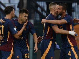Roma's Ukrainian forward #11 Artem Dovbyk (2ndR) celebrates with teammates Roma's Italian midfielder #04 Bryan Christante, Roma's Italian forward #92 Stephan El Shaarawy and Roma's Italian midfielder #61 Niccolo Pisilli after scoring his team first goal during the Italian Serie A football match between AS Roma and Udinese at the Olympic stadium in Rome on September 22, 2024. (Photo by Filippo MONTEFORTE / AFP)