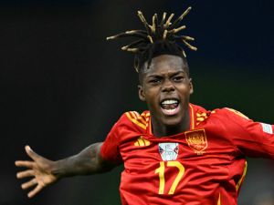 Spain's midfielder #17 Nico Williams celebrates scoring his team's first goal during the UEFA Euro 2024 final football match between Spain and England at the Olympiastadion in Berlin on July 14, 2024. (Photo by INA FASSBENDER / AFP)