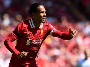 Liverpool's Dutch defender #04 Virgil van Dijk reacts during the pre-season friendly football match between Liverpool and Sevilla at Anfield stadium in Liverpool, northwest England on August 11, 2024. (Photo by Peter POWELL / AFP)