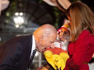 US President Joe Biden jokingly bites a baby dressed as a chicken as he hosts a Halloween trick-or-treat event at the South Portico of the White House in Washington, DC (Image: AFP via Getty Images) US President Joe Biden marks Halloween 2024