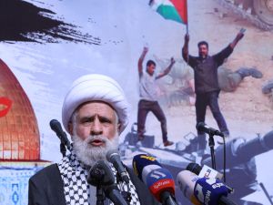 The deputy chief of Lebanon's Shiite militant group Hezbollah, Sheikh Naim Qassem, delivers a speech during a rally in Beirut on October 13, 2023, as thousands of protesters poured onto the streets of several Middle East capitals in support of Palestinians amid Israeli air strikes on Gaza in reprisal for a surprise Hamas attack. (Photo by ANWAR AMRO / AFP) Naim Qassem