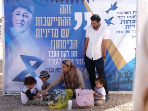 Israeli right-wing activists attend a gathering near the border with Gaza on October 21, 2024, calling to establish a new Jewish settlement in the Gaza Strip, during the holiday of Sukkot, or the Feast of the Tabernacles, amid the ongoing war in the Palestinian territory between Israel and Hamas. (Photo by Menahem KAHANA / AFP) Israeli right-wing activists attend a gathering near the border with Gaza on October 21, 2024, calling to establish a new Jewish settlement in the Gaza Strip.