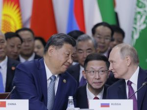 Russian President Vladimir Putin and Chinese President Xi Jinping speak during a plenary session in the outreach/BRICS Plus format at the BRICS summit in Kazan on October 24, 2024. (Photo by Maxim Shemetov / POOL / AFP) Russian President Vladimir Putin and Chinese President Xi Jinping