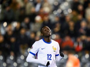 France's forward #12 Randal Kolo Muani reacts after missing a goal opportunity during the UEFA Nations League League A, Group A2 football match between Belgium and France, at the King Baudouin Stadium in Brussels, on October 14, 2024. (Photo by JOHN THYS / AFP)