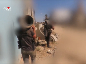 Al-Qassam Brigades Fighters holding  "Shawaz" explosives